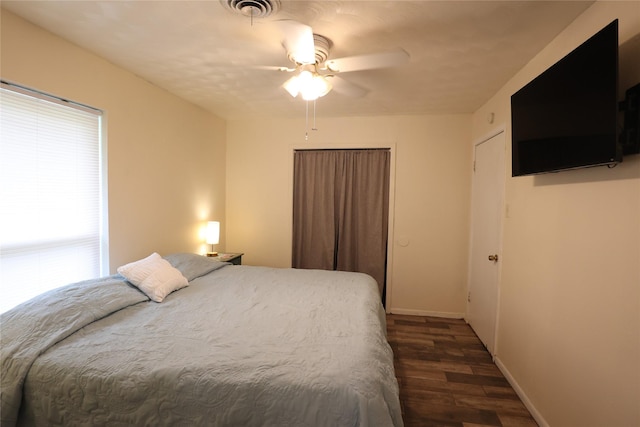 1205 Carmie St, Alvin, TX 77511 - bedroom featuring dark wood-type flooring and a ceiling fan