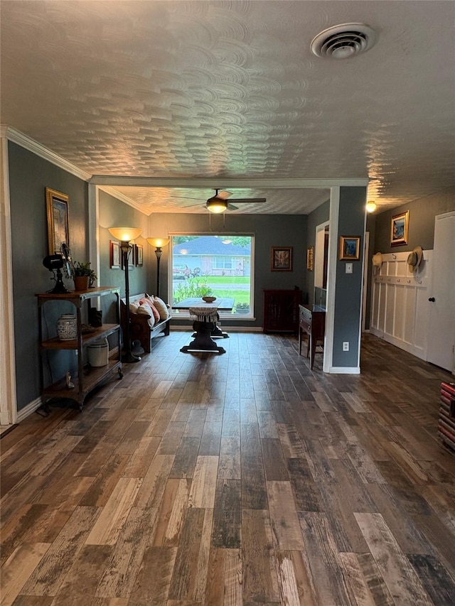 1205 Carmie St, Alvin, TX 77511 - living area with dark wood-style flooring, a ceiling fan, and ornamental molding