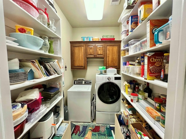 1464 S Bluebonnet Ln, Angleton, TX 77515 - washroom with separate washer and dryer and cabinet space