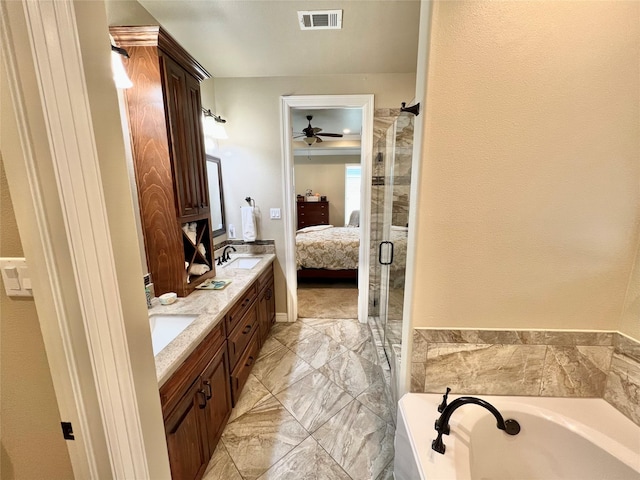 1464 S Bluebonnet Ln, Angleton, TX 77515 - bathroom featuring ensuite bathroom, double vanity, a ceiling fan, a garden tub, and a shower with shower door