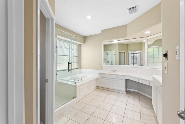 20731 Maple Village Dr, Cypress, TX 77433 - bathroom featuring vanity, a bath, healthy amount of natural light, tile patterned floors, and recessed lighting