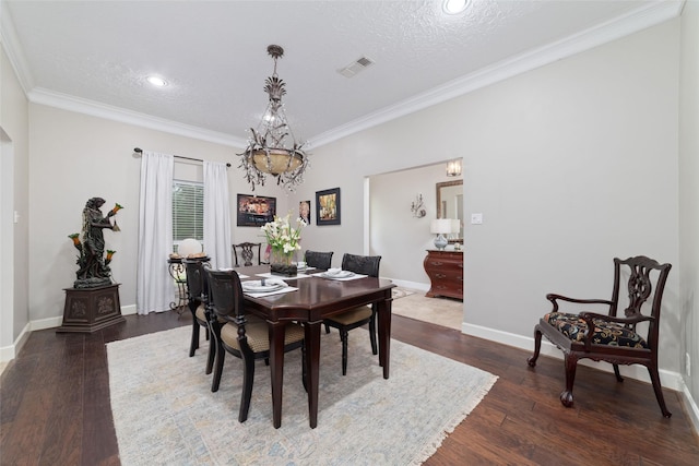 13302 Holston Hills Dr, Houston, TX 77069 - dining room with crown molding, a chandelier, wood finished floors, a textured ceiling, and recessed lighting