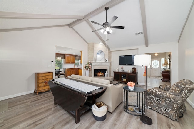 13302 Holston Hills Dr, Houston, TX 77069 - living room with light wood finished floors, ceiling fan, and a large fireplace