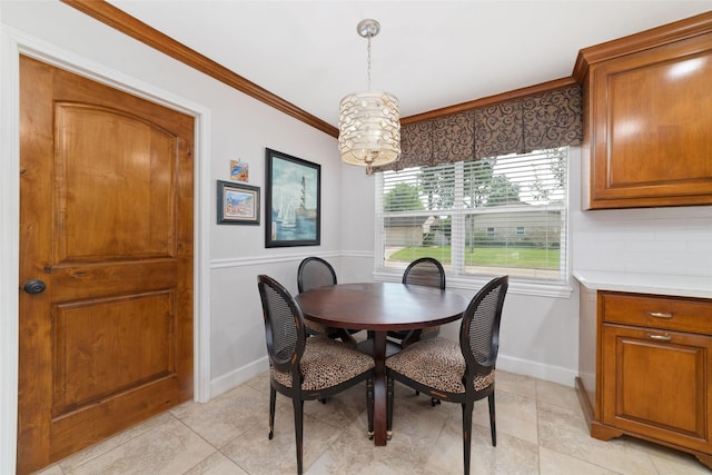 13302 Holston Hills Dr, Houston, TX 77069 - dining space with light tile patterned floors, crown molding, and a chandelier