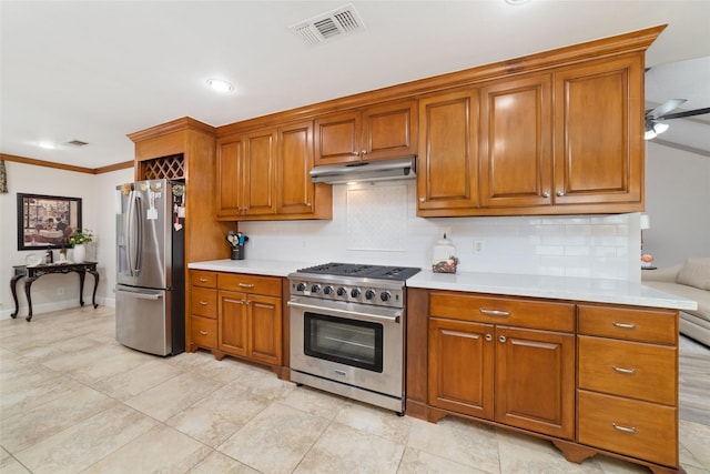 13302 Holston Hills Dr, Houston, TX 77069 - kitchen with appliances with stainless steel finishes, under cabinet range hood, brown cabinetry, tasteful backsplash, and crown molding
