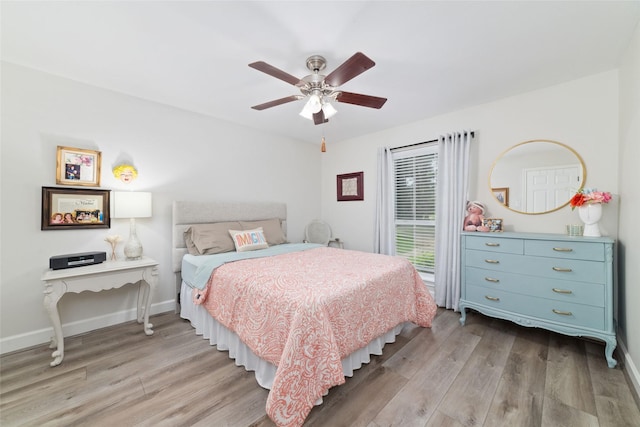 13302 Holston Hills Dr, Houston, TX 77069 - bedroom with light wood-type flooring and a ceiling fan