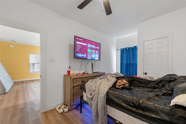8211 Barlow St, Houston, TX 77028 - bedroom featuring light wood-type flooring and ceiling fan
