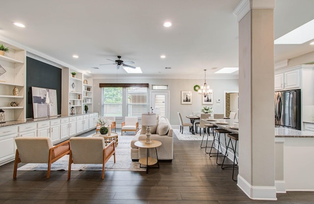 931 Shirkmere Rd, Houston, TX 77008 - living area with crown molding, a ceiling fan, recessed lighting, dark wood finished floors, and a chandelier