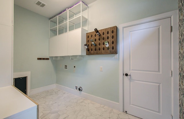 931 Shirkmere Rd, Houston, TX 77008 - washroom featuring cabinet space, hookup for a washing machine, hookup for an electric dryer, hookup for a gas dryer, and marble finish floors
