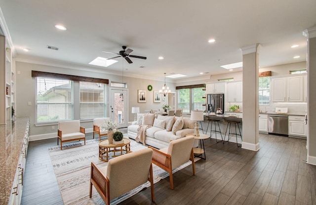 931 Shirkmere Rd, Houston, TX 77008 - living area featuring a ceiling fan, ornamental molding, a skylight, recessed lighting, and a chandelier