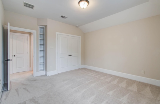 931 Shirkmere Rd, Houston, TX 77008 - unfurnished bedroom with light carpet, a closet, and lofted ceiling