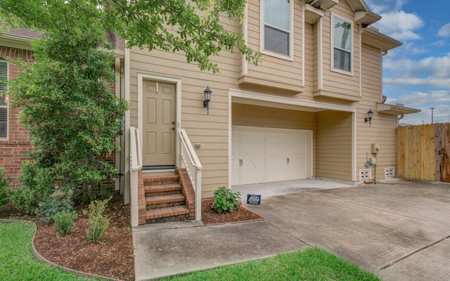 931 Shirkmere Rd, Houston, TX 77008 - doorway to property featuring an attached garage and driveway