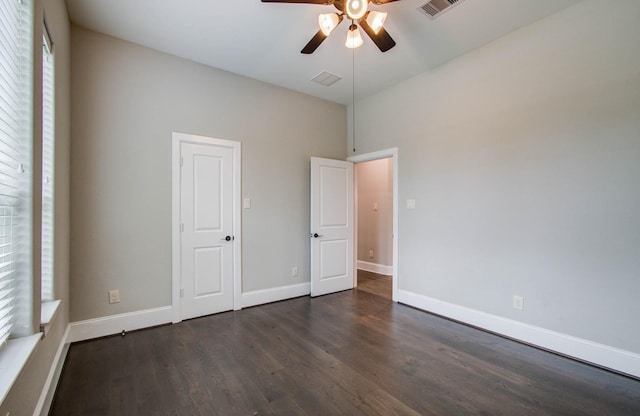 931 Shirkmere Rd, Houston, TX 77008 - unfurnished bedroom with dark wood finished floors and a ceiling fan