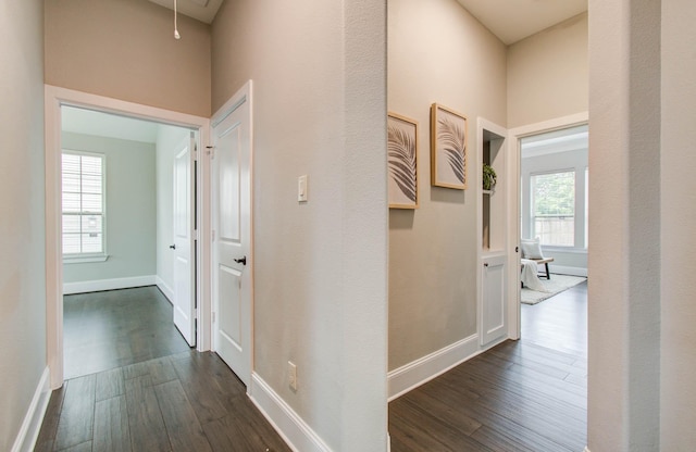 931 Shirkmere Rd, Houston, TX 77008 - corridor with dark wood-type flooring, healthy amount of natural light, attic access, and a high ceiling