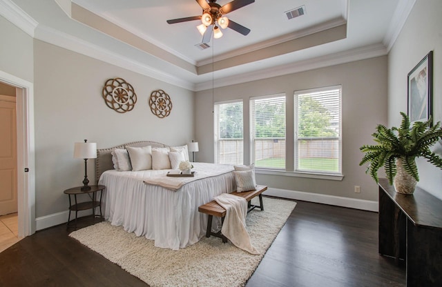 931 Shirkmere Rd, Houston, TX 77008 - bedroom with a raised ceiling, dark wood-style floors, ornamental molding, and a ceiling fan