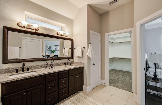 931 Shirkmere Rd, Houston, TX 77008 - full bathroom with double vanity, tile patterned floors, and a walk in closet