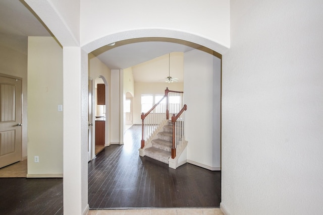 6533 Gray Birch Ln, Dickinson, TX 77539 - entryway featuring ceiling fan, arched walkways, wood-type flooring, stairs, and high vaulted ceiling