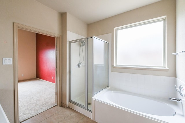 6533 Gray Birch Ln, Dickinson, TX 77539 - bathroom with a shower stall, a bath, and tile patterned flooring