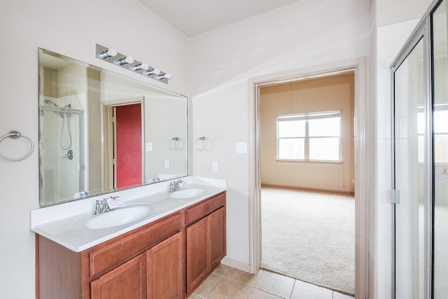 6533 Gray Birch Ln, Dickinson, TX 77539 - bathroom featuring double vanity, tile patterned flooring, and a shower with shower door