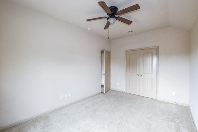 6533 Gray Birch Ln, Dickinson, TX 77539 - unfurnished bedroom featuring carpet, a closet, vaulted ceiling, and a ceiling fan