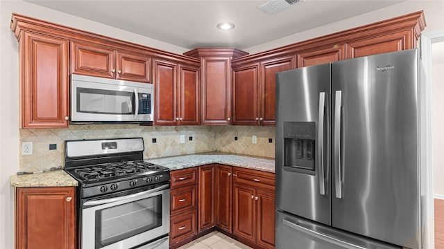 9643 Val Verde St, Houston, TX 77063 - kitchen with appliances with stainless steel finishes, light stone countertops, tasteful backsplash, and recessed lighting