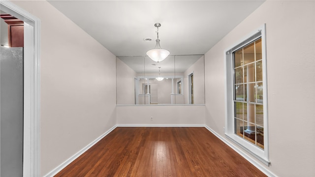 9643 Val Verde St, Houston, TX 77063 - unfurnished dining area with wood finished floors and baseboards