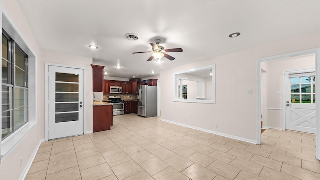 9643 Val Verde St, Houston, TX 77063 - kitchen featuring stainless steel appliances, ceiling fan, recessed lighting, light tile patterned flooring, and open floor plan