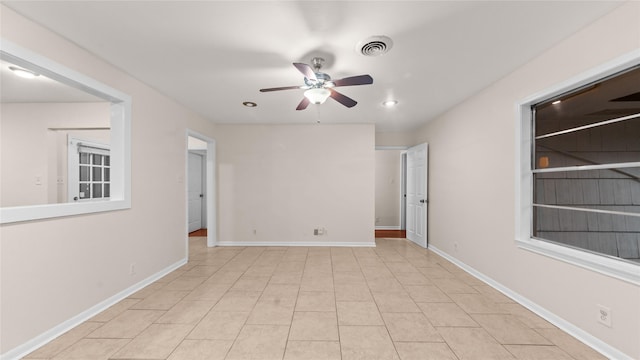 9643 Val Verde St, Houston, TX 77063 - spare room featuring a ceiling fan, light tile patterned floors, and recessed lighting