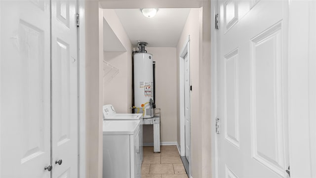 9643 Val Verde St, Houston, TX 77063 - washroom with gas water heater, separate washer and dryer, and light tile patterned floors