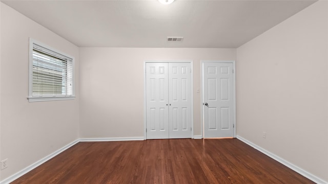 9643 Val Verde St, Houston, TX 77063 - unfurnished bedroom with wood finished floors and a closet