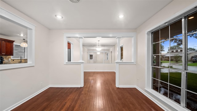 9643 Val Verde St, Houston, TX 77063 - hall featuring dark wood-type flooring and recessed lighting