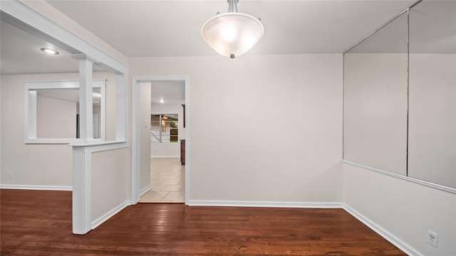 9643 Val Verde St, Houston, TX 77063 - unfurnished dining area featuring baseboards and wood finished floors