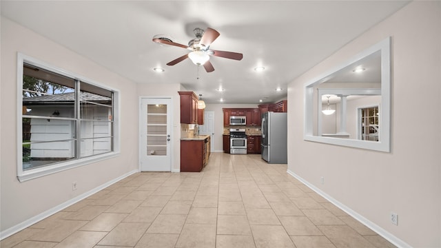 9643 Val Verde St, Houston, TX 77063 - kitchen featuring appliances with stainless steel finishes, a ceiling fan, decorative backsplash, light tile patterned floors, and recessed lighting