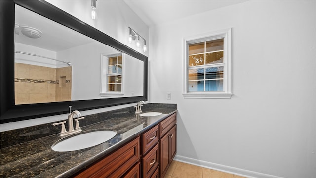 9643 Val Verde St, Houston, TX 77063 - bathroom with double vanity, tile patterned floors, and a shower