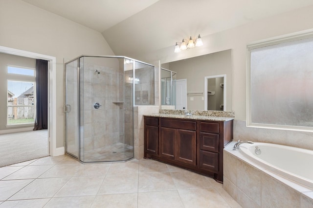 1215 Oxbow Crossing Ln, Rosenberg, TX 77471 - full bathroom featuring a stall shower, vanity, tile patterned floors, a bath, and vaulted ceiling