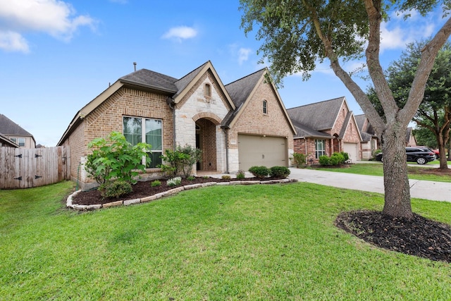 1215 Oxbow Crossing Ln, Rosenberg, TX 77471 - french country inspired facade featuring brick siding, driveway, a garage, and stone siding