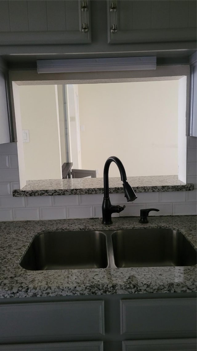 8367 Nairn St, Houston, TX 77074 - kitchen view of light stone countertops and backsplash