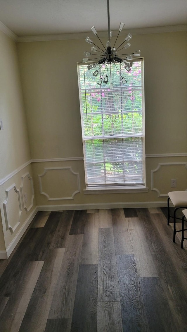 8367 Nairn St, Houston, TX 77074 - unfurnished dining area with a chandelier, crown molding, plenty of natural light, and wood finished floors