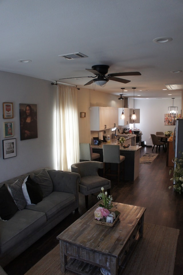 4217 Sterling St, Houston, TX 77051 - living room featuring dark wood-style floors, a ceiling fan, and recessed lighting