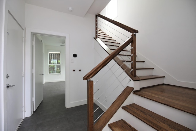 5711 Kansas, Houston, TX 77007 - stairs with baseboards and tile patterned floors