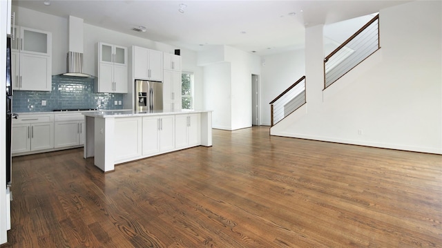 5711 Kansas, Houston, TX 77007 - kitchen with stainless steel fridge, wall chimney range hood, open floor plan, black electric cooktop, and a kitchen island