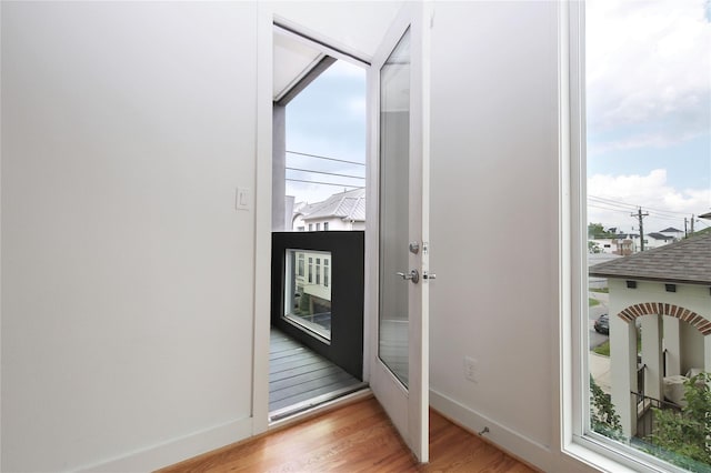 5711 Kansas, Houston, TX 77007 - doorway to outside with wood finished floors and baseboards