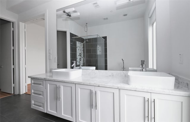 5711 Kansas, Houston, TX 77007 - bathroom with double vanity and tiled shower