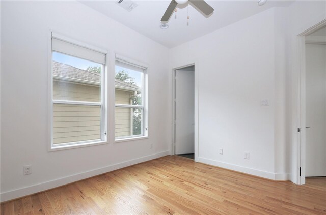 5711 Kansas, Houston, TX 77007 - empty room with ceiling fan and light wood-type flooring