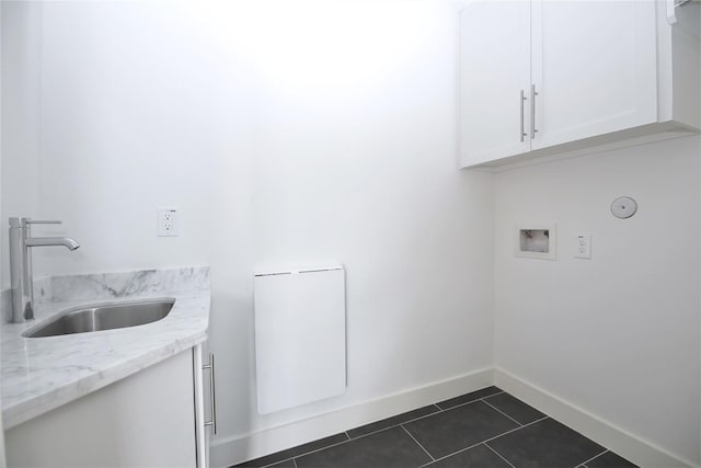 5711 Kansas, Houston, TX 77007 - laundry room featuring cabinet space, dark tile patterned floors, and hookup for a washing machine