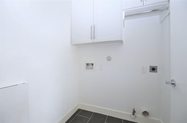 5711 Kansas, Houston, TX 77007 - laundry room featuring hookup for a gas dryer, hookup for an electric dryer, cabinet space, washer hookup, and dark tile patterned floors