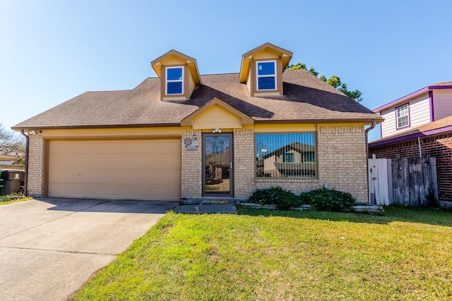 6335 Danshire Ct, Houston, TX 77049 - view of front of home featuring brick siding, a garage, concrete driveway, and a shingled roof