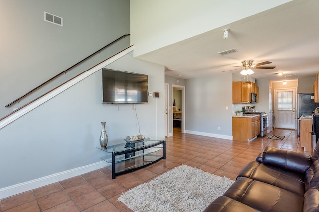 6335 Danshire Ct, Houston, TX 77049 - living room featuring a ceiling fan and light tile patterned floors