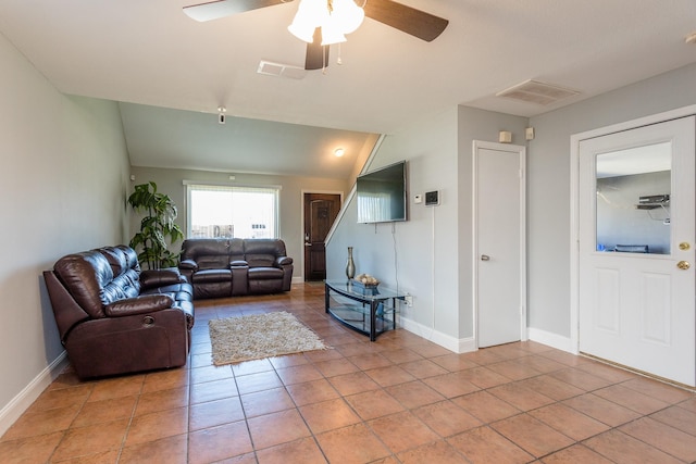 6335 Danshire Ct, Houston, TX 77049 - living area featuring light tile patterned flooring, a ceiling fan, and lofted ceiling
