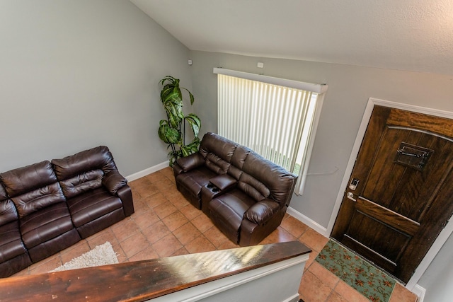 6335 Danshire Ct, Houston, TX 77049 - living room featuring tile patterned flooring and lofted ceiling